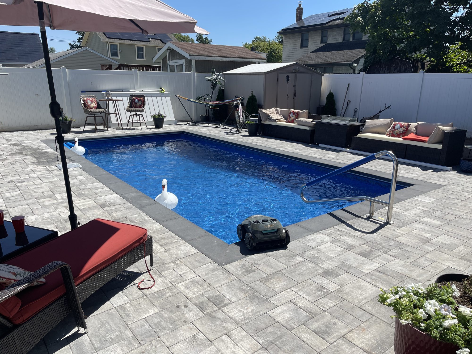 Contemporary Inground Pool with Charcoal Coping