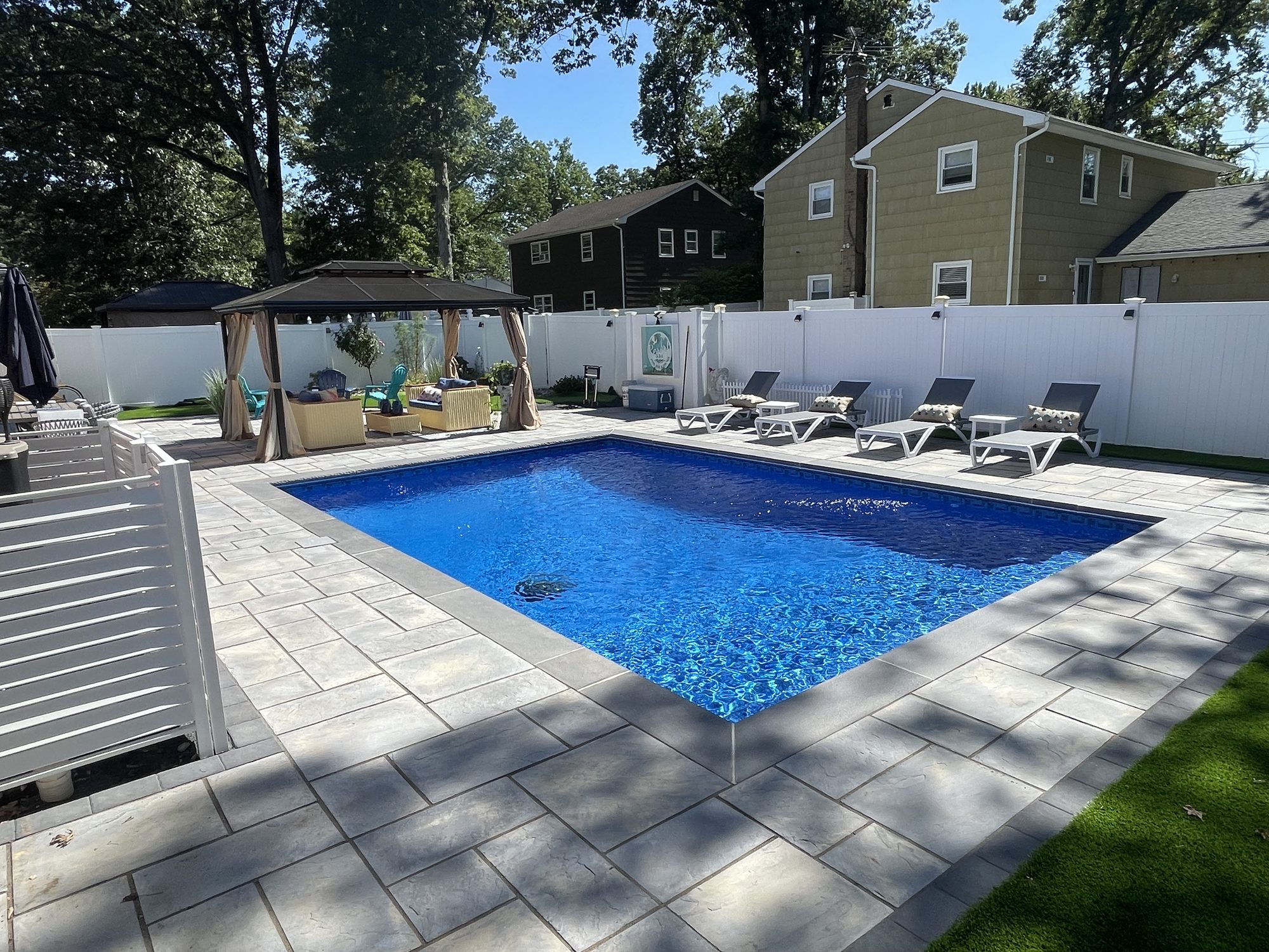 Backyard Inground Pool with Light Grey Pavers